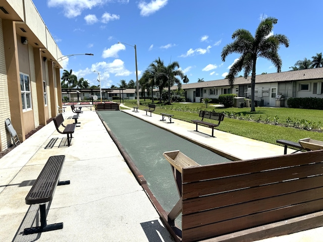 view of community featuring a residential view and a yard