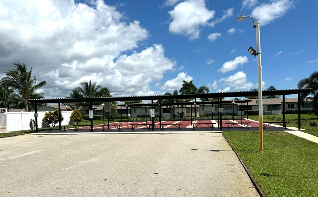 view of home's community featuring a lawn