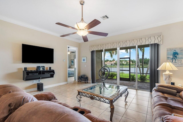 living room featuring ceiling fan, light tile patterned floors, and ornamental molding