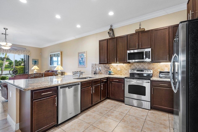 kitchen featuring kitchen peninsula, stainless steel appliances, crown molding, and sink