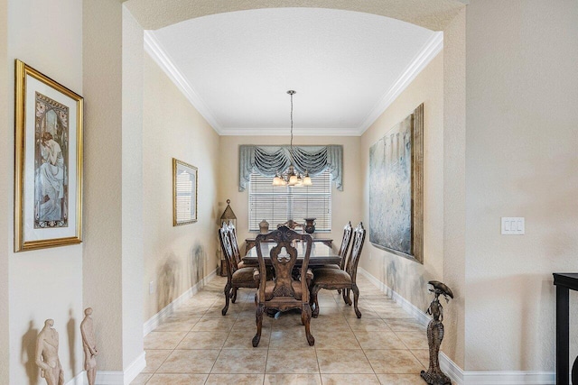 tiled dining room with a chandelier and crown molding