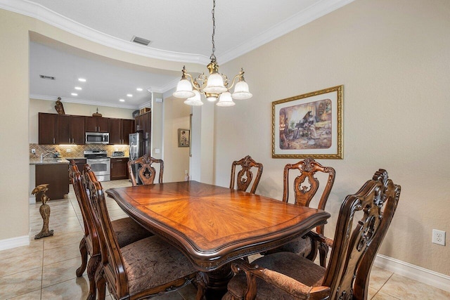 tiled dining space featuring crown molding and a notable chandelier