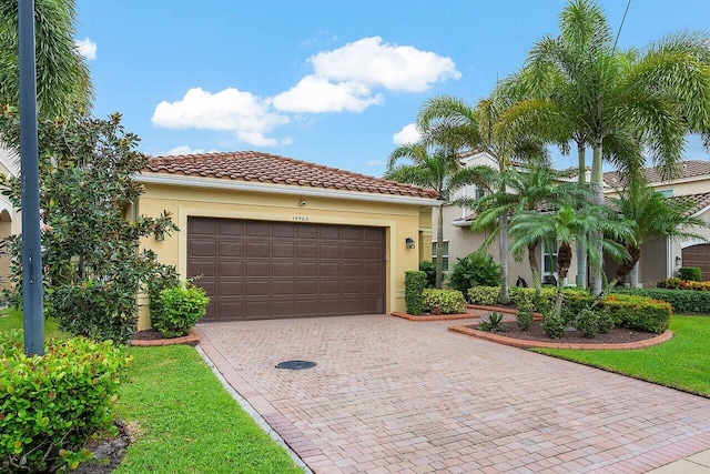 mediterranean / spanish house with a garage