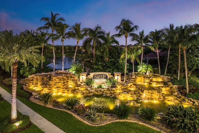 surrounding community featuring a water view