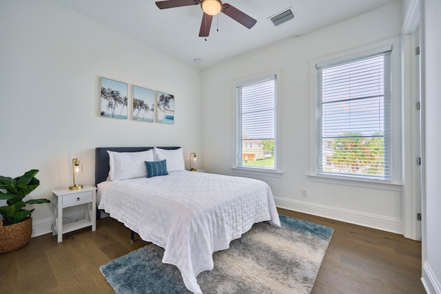 bedroom featuring ceiling fan and dark hardwood / wood-style flooring