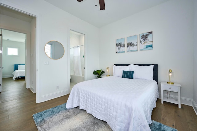 bedroom featuring dark wood-type flooring, ensuite bathroom, and ceiling fan