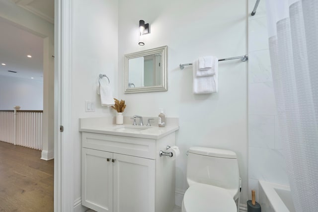 full bathroom with vanity, shower / bath combo with shower curtain, wood-type flooring, and toilet