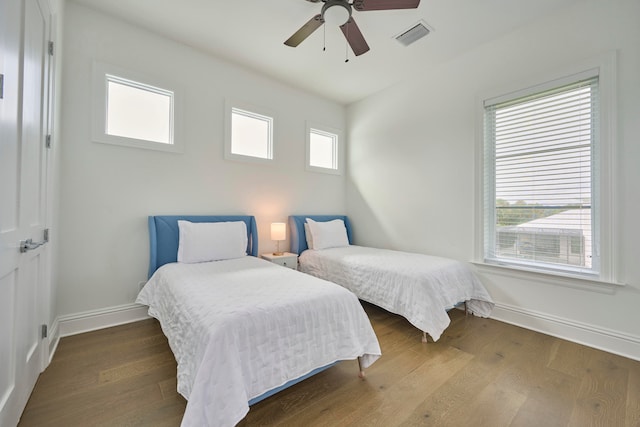 bedroom with hardwood / wood-style flooring and ceiling fan