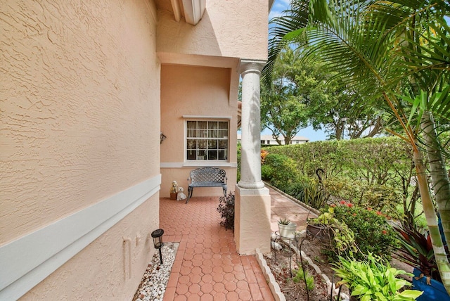 view of side of property with a patio