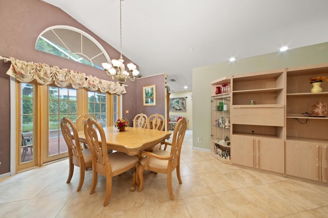 dining room with light tile patterned floors, a notable chandelier, lofted ceiling, and a wealth of natural light