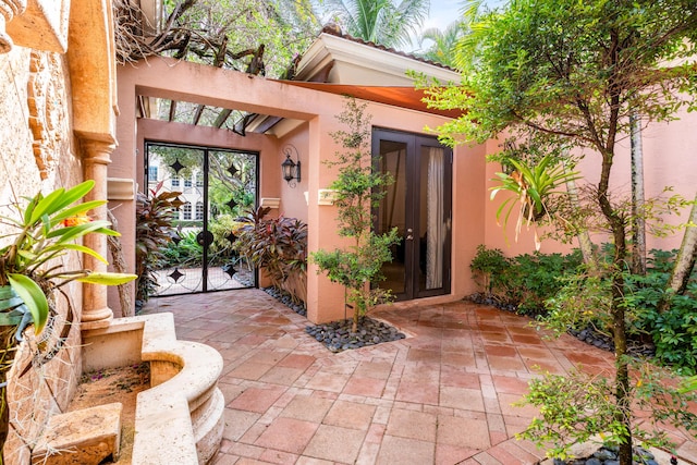 doorway to property featuring a patio area and french doors