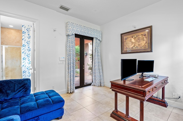 tiled office space featuring french doors