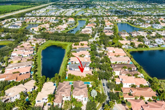 birds eye view of property with a water view