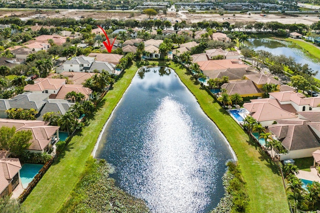 bird's eye view with a water view