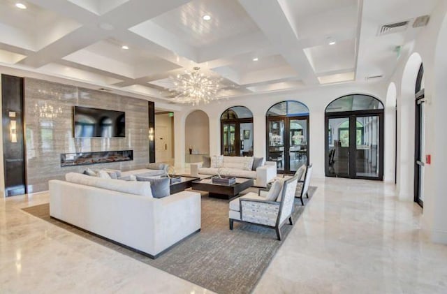 living room with beam ceiling, french doors, and coffered ceiling