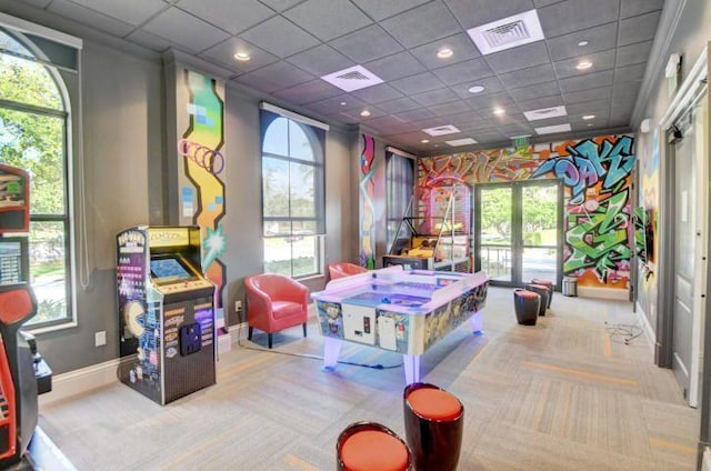 playroom featuring a drop ceiling, light colored carpet, and french doors