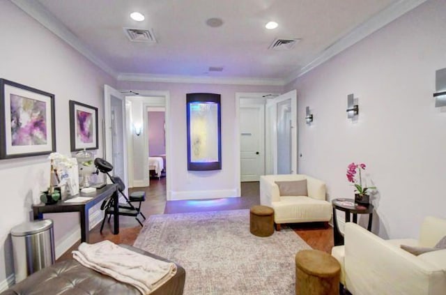 living area with dark wood-type flooring and ornamental molding