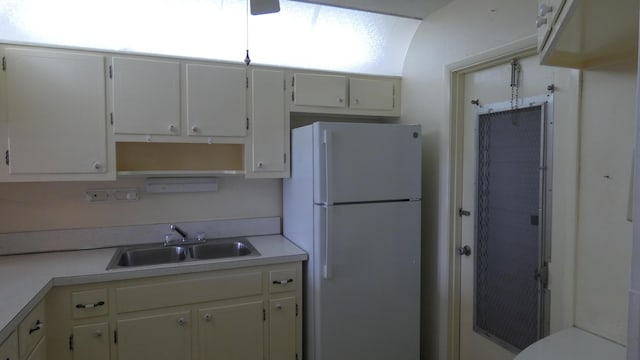 kitchen featuring sink and white refrigerator