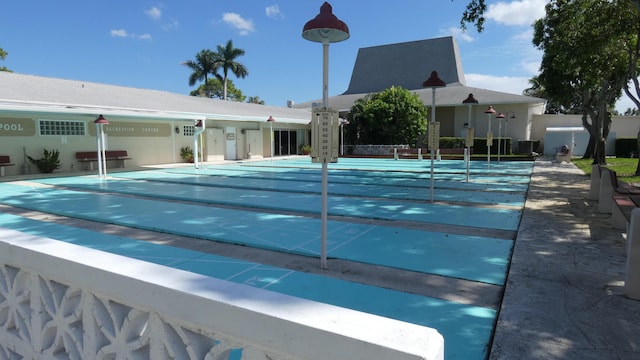 view of pool featuring area for grilling