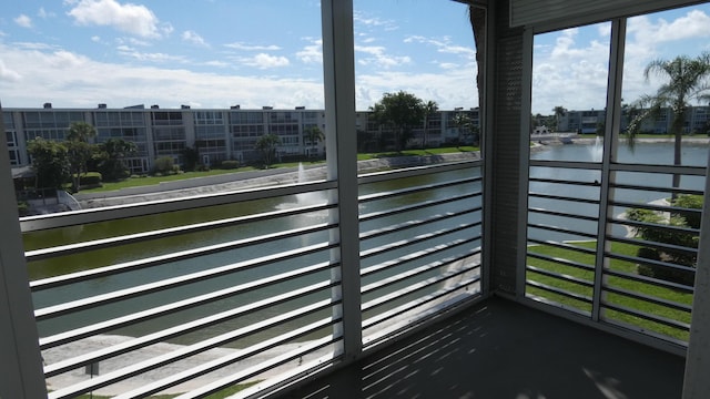 balcony featuring a water view