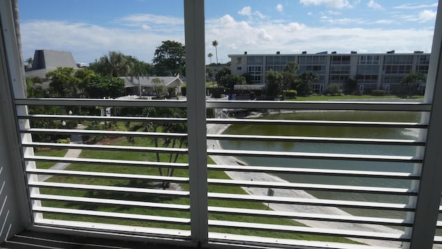 view of gate with a water view