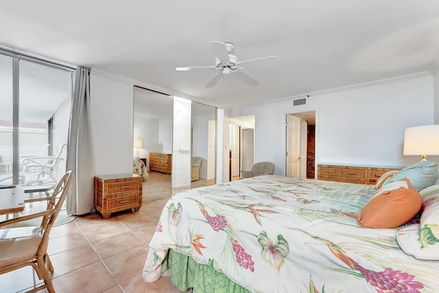 tiled bedroom featuring ceiling fan and ornamental molding