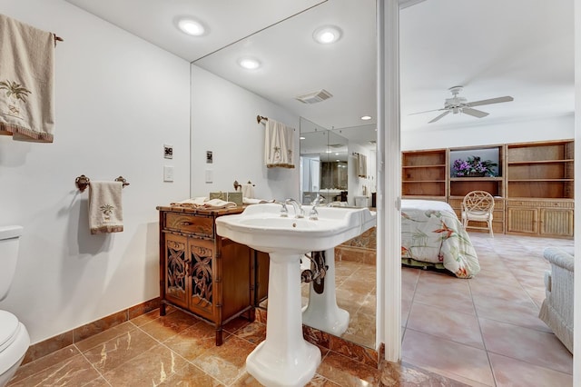 bathroom with toilet and ceiling fan