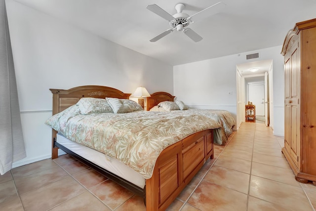 bedroom featuring light tile patterned floors and ceiling fan