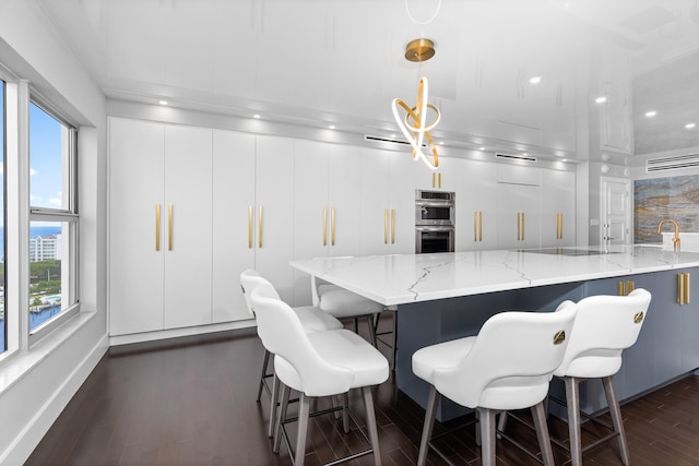 875 E Camino Real Unit 16H & G, Boca Raton, FL 33432 - dining space with plenty of natural light, dark wood-style floors, recessed lighting, and baseboards