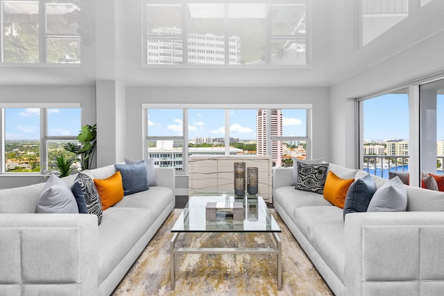 living room with a towering ceiling