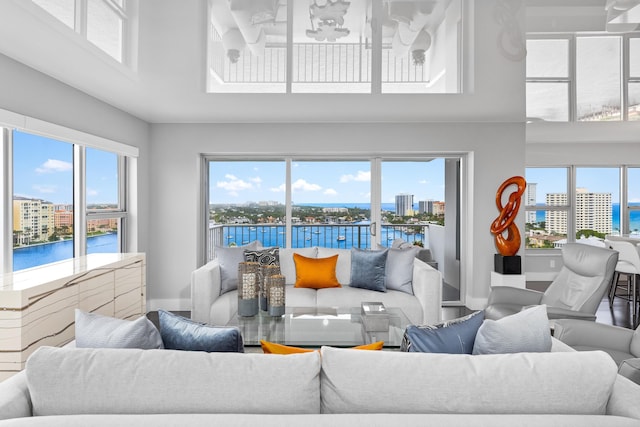 living room featuring a water view and a wealth of natural light