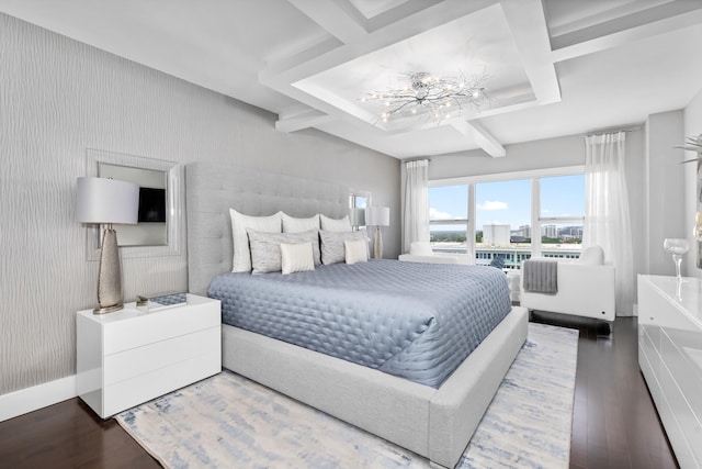 bedroom with wood-type flooring and an inviting chandelier