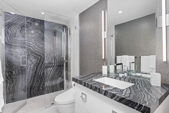 875 E Camino Real Unit 16H & G, Boca Raton, FL 33432 - bathroom with toilet, vanity, a marble finish shower, recessed lighting, and tile walls