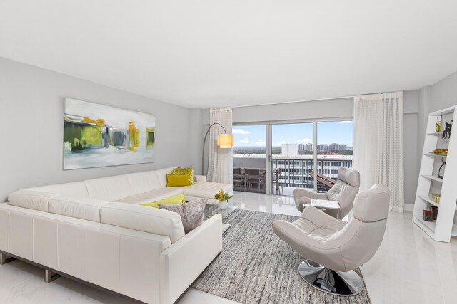875 E Camino Real Unit 16H & G, Boca Raton, FL 33432 - living area with light marble finish floors and a city view