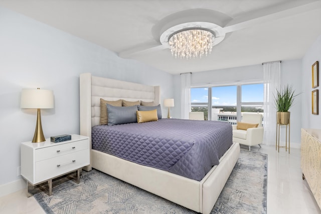 875 E Camino Real Unit 16H & G, Boca Raton, FL 33432 - bedroom featuring a chandelier and baseboards