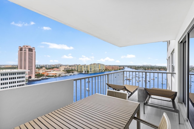 balcony featuring a water view