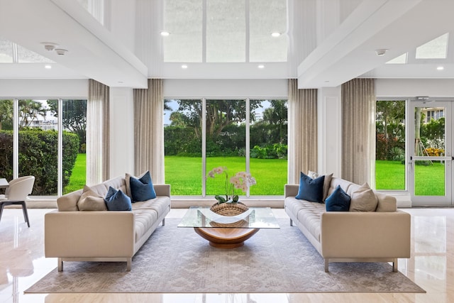 875 E Camino Real Unit 16H & G, Boca Raton, FL 33432 - living room featuring a high ceiling, plenty of natural light, and recessed lighting