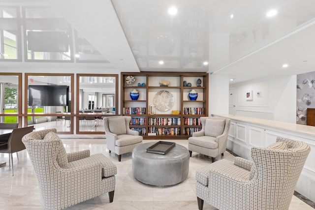 875 E Camino Real Unit 16H & G, Boca Raton, FL 33432 - living room featuring a decorative wall and recessed lighting