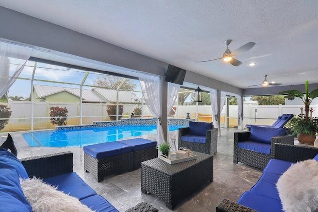 view of swimming pool with a lanai, outdoor lounge area, and a patio area