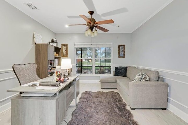 living room featuring ornamental molding and ceiling fan