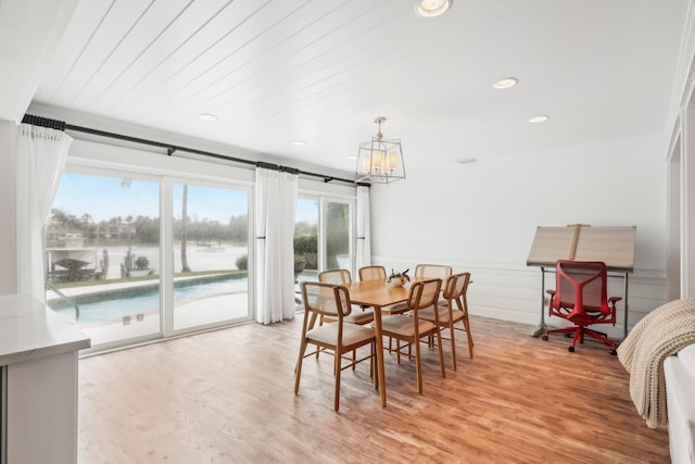 dining space with light hardwood / wood-style floors