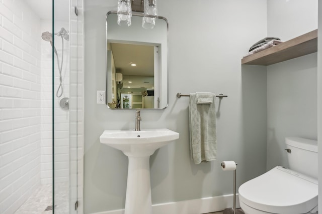 bathroom featuring an enclosed shower and toilet