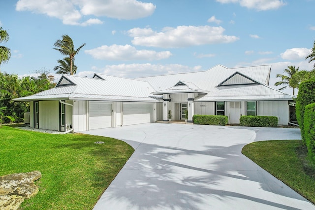 view of front of property featuring a garage and a front yard