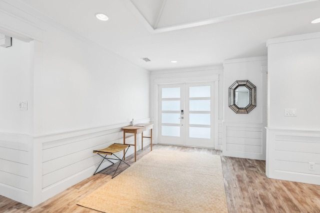 foyer featuring french doors and hardwood / wood-style flooring