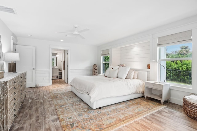 bedroom featuring wood-type flooring and ceiling fan