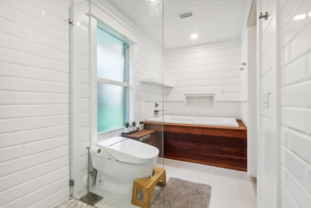 bathroom with tile patterned flooring and toilet