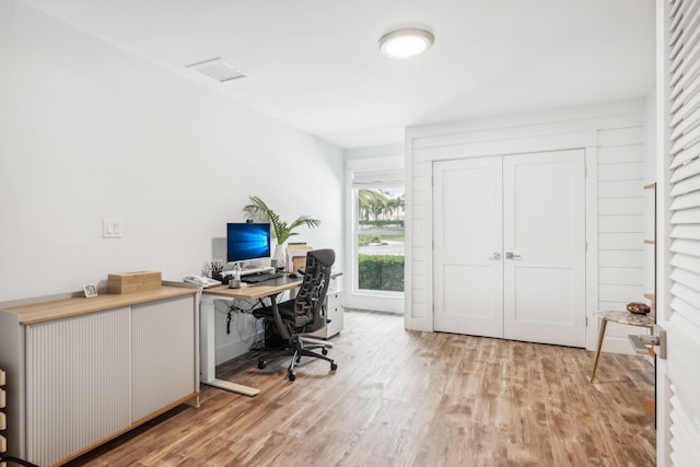 office with light hardwood / wood-style floors