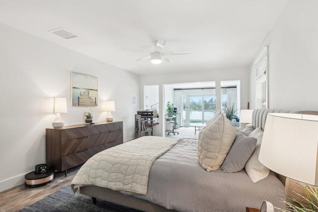 bedroom featuring access to outside, light hardwood / wood-style floors, and ceiling fan