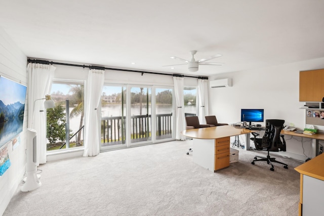 carpeted office space featuring ceiling fan and an AC wall unit