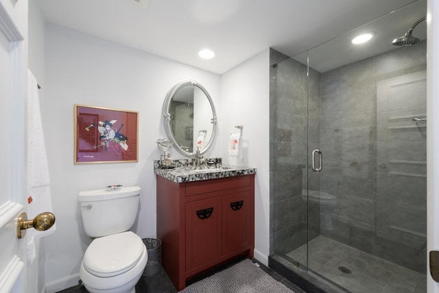 bathroom with vanity, toilet, and walk in shower